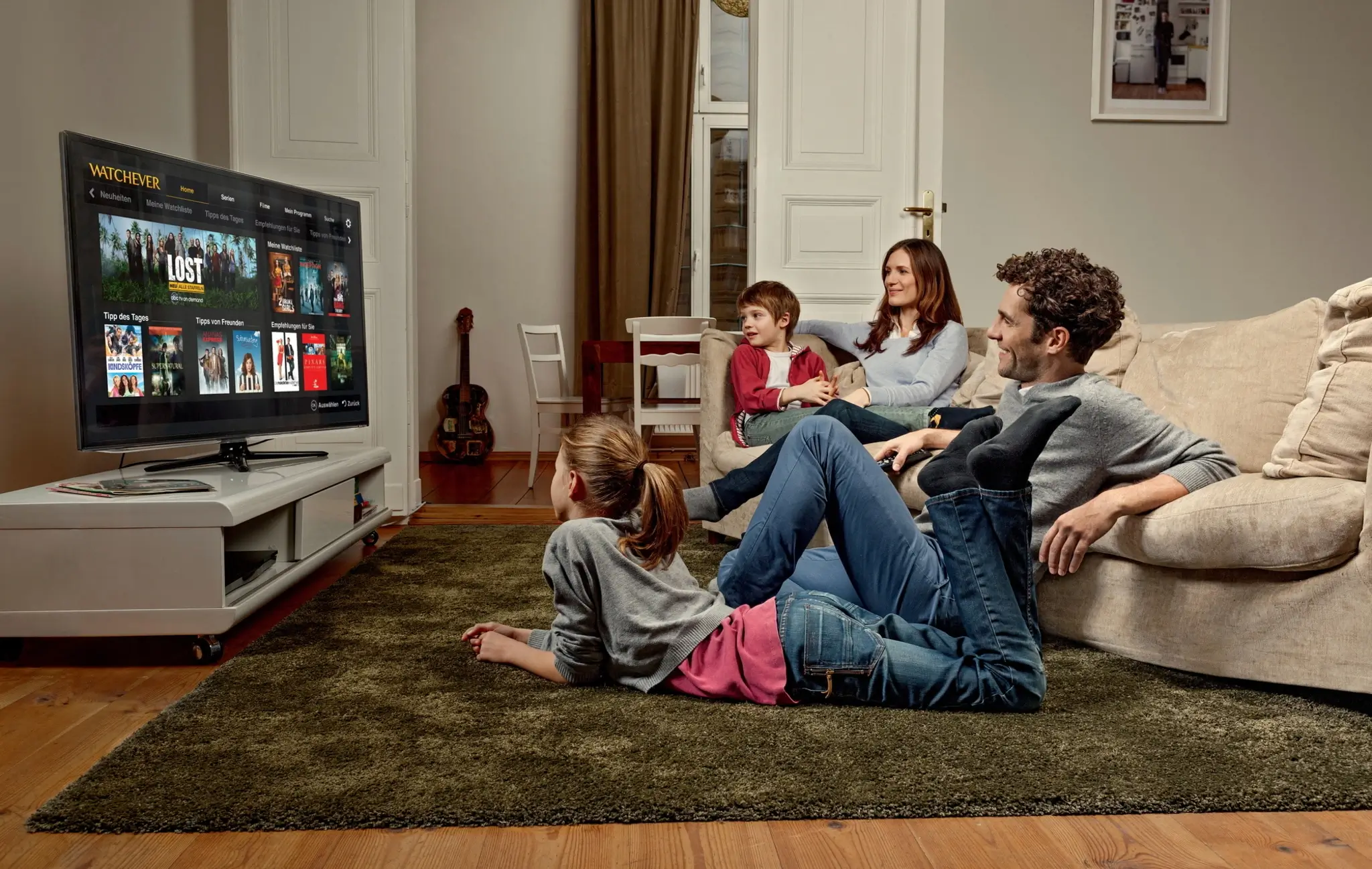 Family watching IPTV UK subscription on Smart TV — 18000 channels included